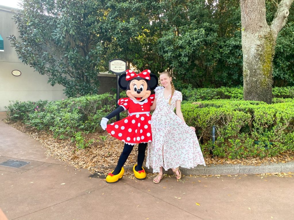 photo with Minnie Mouse; keep your precious photos safe by adding a flash drive to your Disney packing list