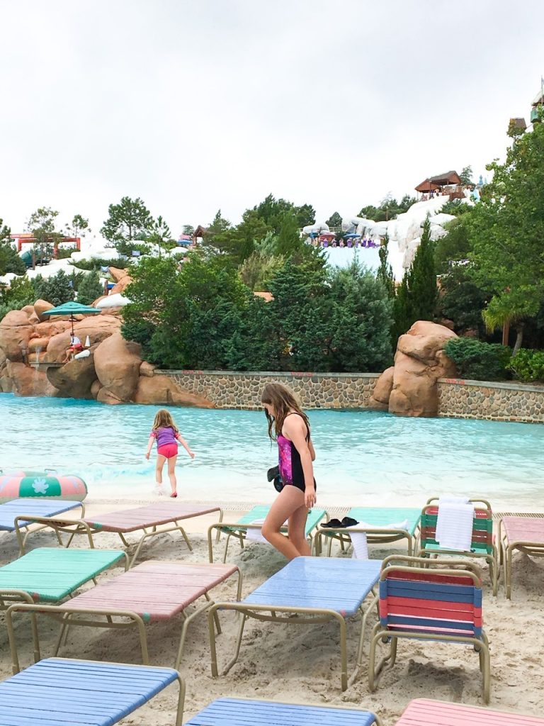 photo of children amongst sun loungers by the wave pool at Blizzard beach - which wave pool will you prefer - Blizzard Beach or Typhoon Lagoon?