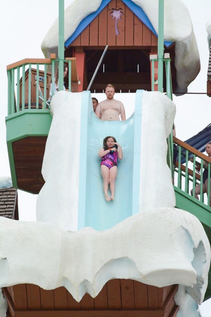 photo of girl on Summit Plummet - the highest, fastest slide in the water parks at Disney