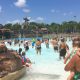 Photo of people waiting for the surf in the Typhoon Lagoon wave pool - will this end your Typhoon Lagoon vs Blizzard Beach debate?