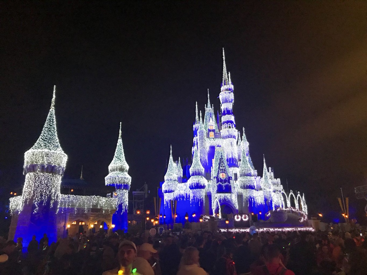 night view from the side of Cinderella Castle with icicle lights for Christmas