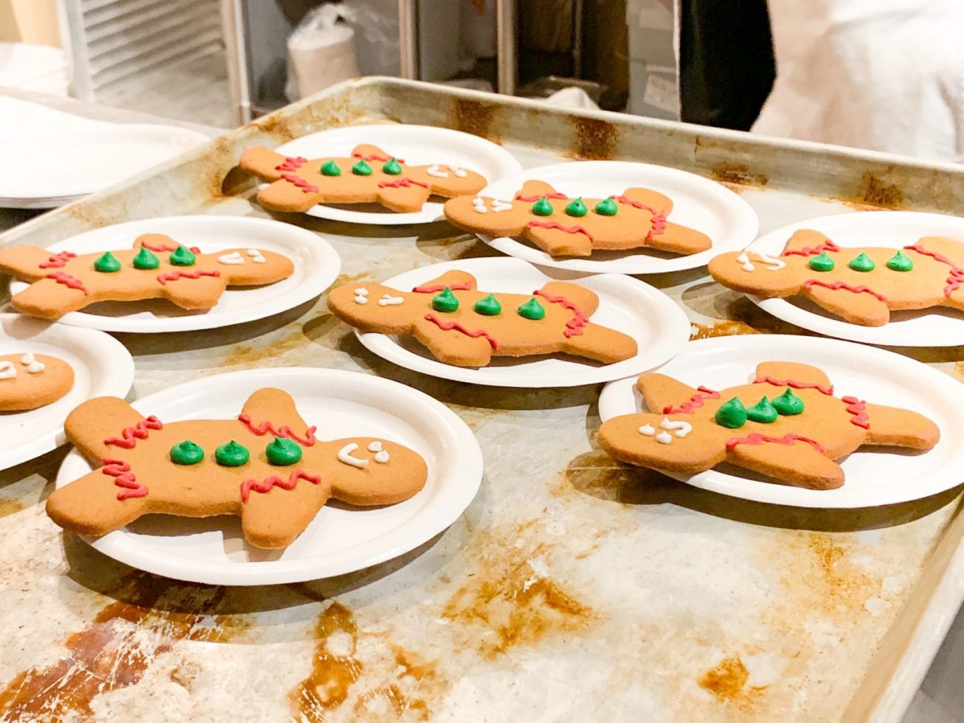 gingerbread man cookies sitting on plates ready to be served