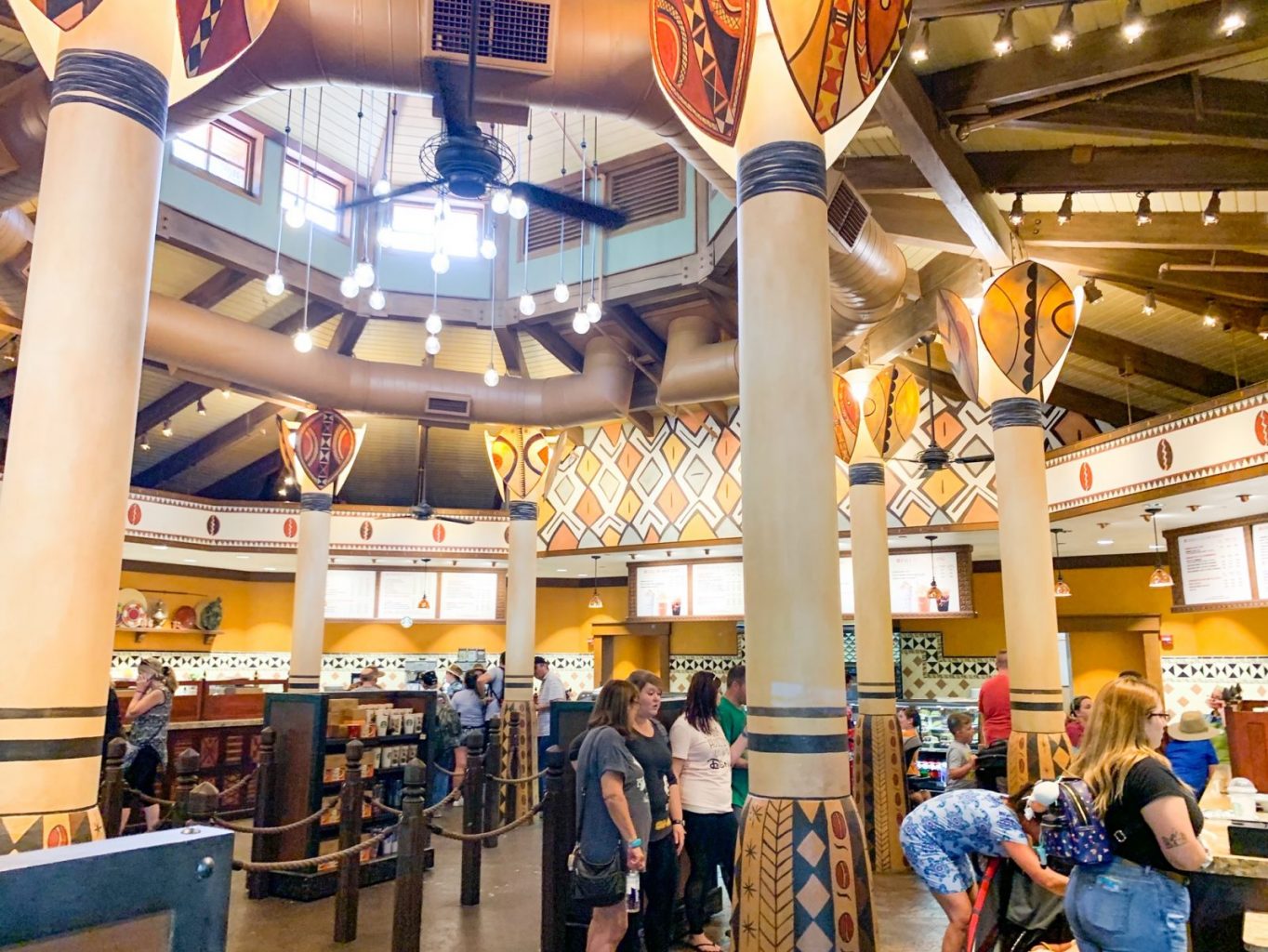 animal kingdom breakfast creature comforts inside with Starbucks menu and yellow high ceilings 