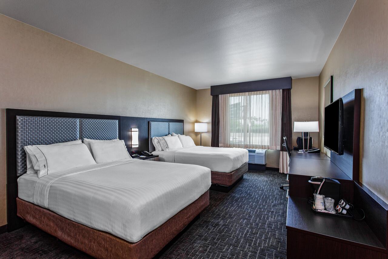 A queen room inside the Holiday Inn Express Hotel near Disneyland