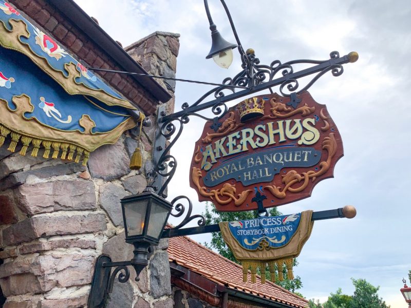 stone building with ornate decorative sign for akershus royal banquet hall breakfast at Epcot 