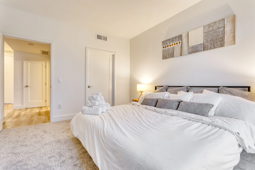 the bedroom with a giant comfy bed in the Stylish Apartment vacation rental near Disneyland