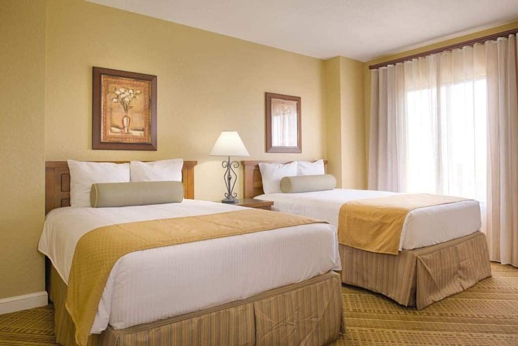 view of the bedroom in the two bedroom deluxe with balcony airbnb