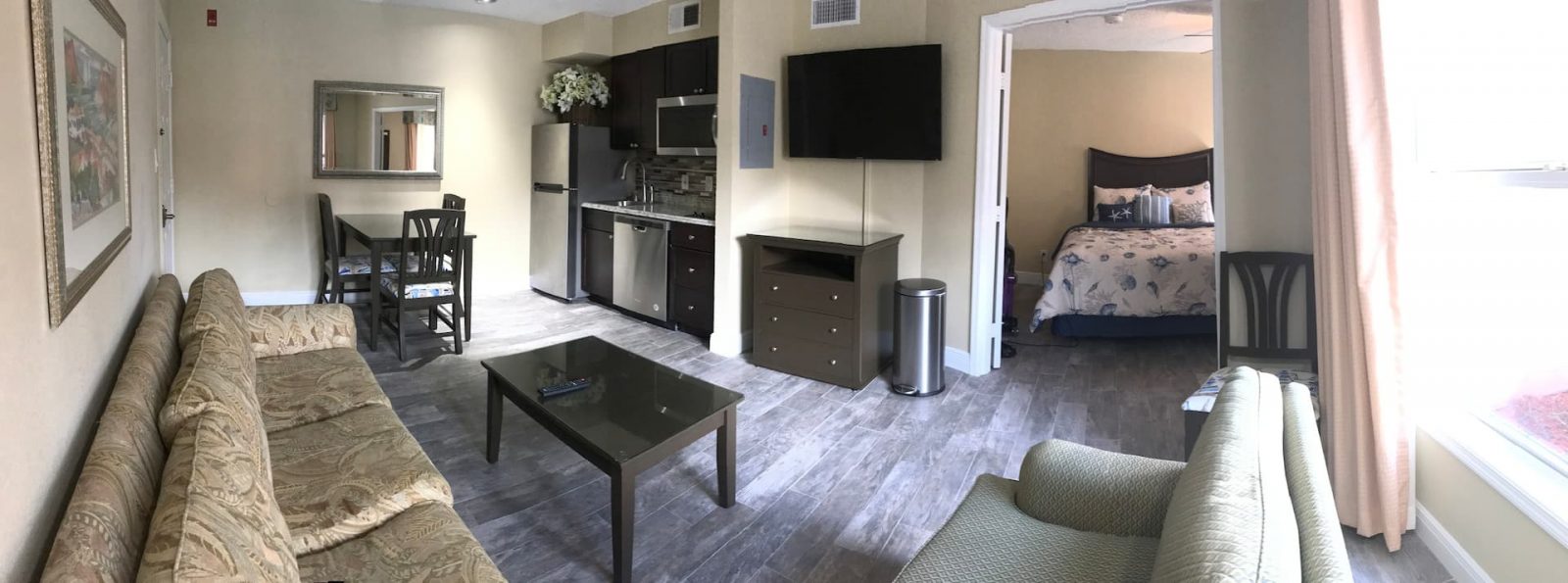 view of the living room and kitchen in the minutes away disney universal sea world airbnb