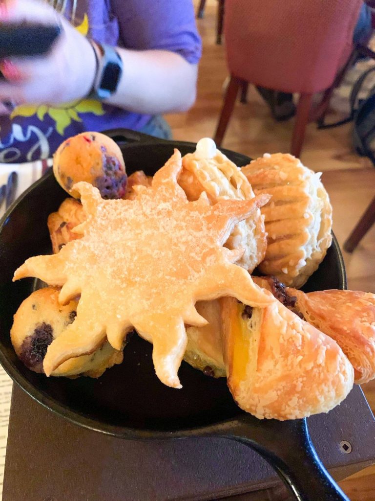 disney arrival day scones and treats at trattoria al Forno Rapunzel sun and Ariel oyster theme