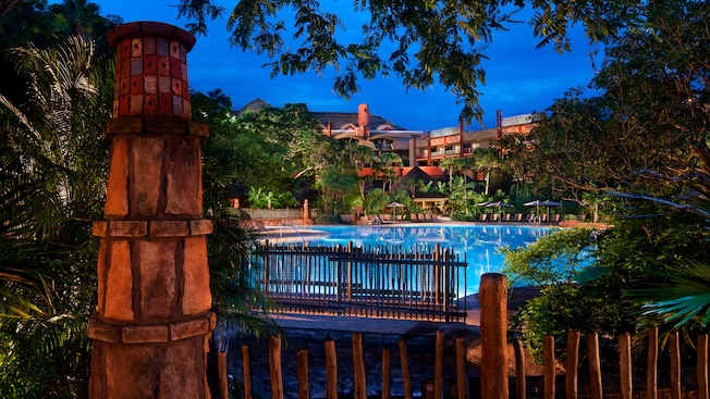 view of the animal kingdom lodge pool at night