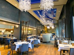 elegant tables and chairs inside fancy restaurant 