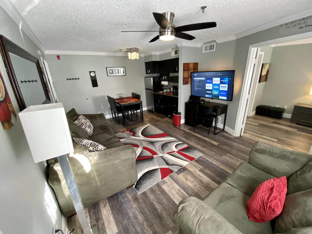 view of the living room and kitchen in the Family Condo 2 bedroom vacation rental near Disney