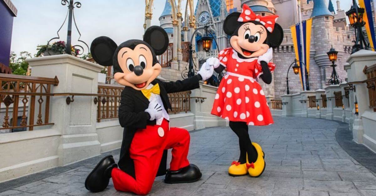 Mickey and Minnie in front of Disneyland castle