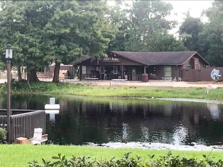 view of a lake and the bike barn at fort wilderness