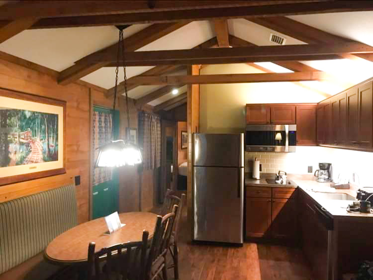 view of the kitchen and dining table inside the cabins at fort wilderness