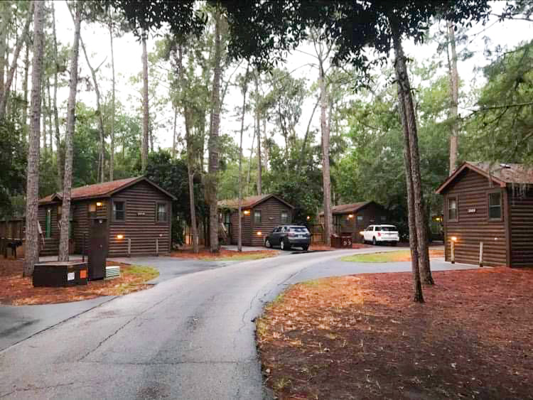 view of multiple cabins in the woods at fort wilderness