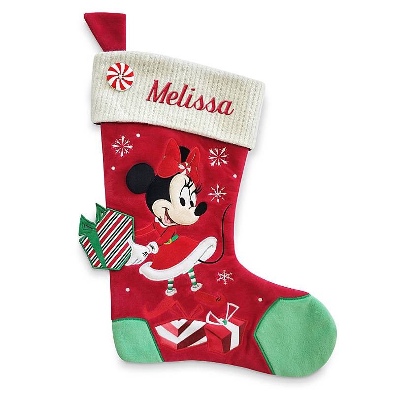 Minnie Mouse holds a present on a Christmas stocking