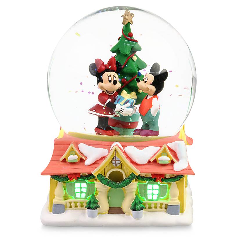 Mickey and Minnie stand in front of a Christmas tree in this snow globe with a base of Mickey's Toon Town house