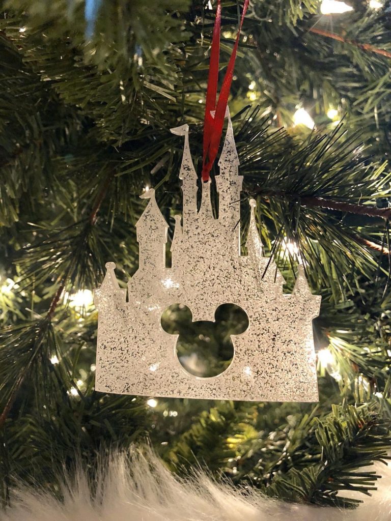 Disney ornament glitter acrylic cutout of Cinderella's castle with Mickey head shape inside