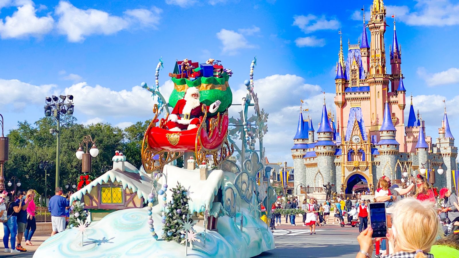 Santa and his sleigh in front of Cinderella's Castle at Disney Christmas 2020