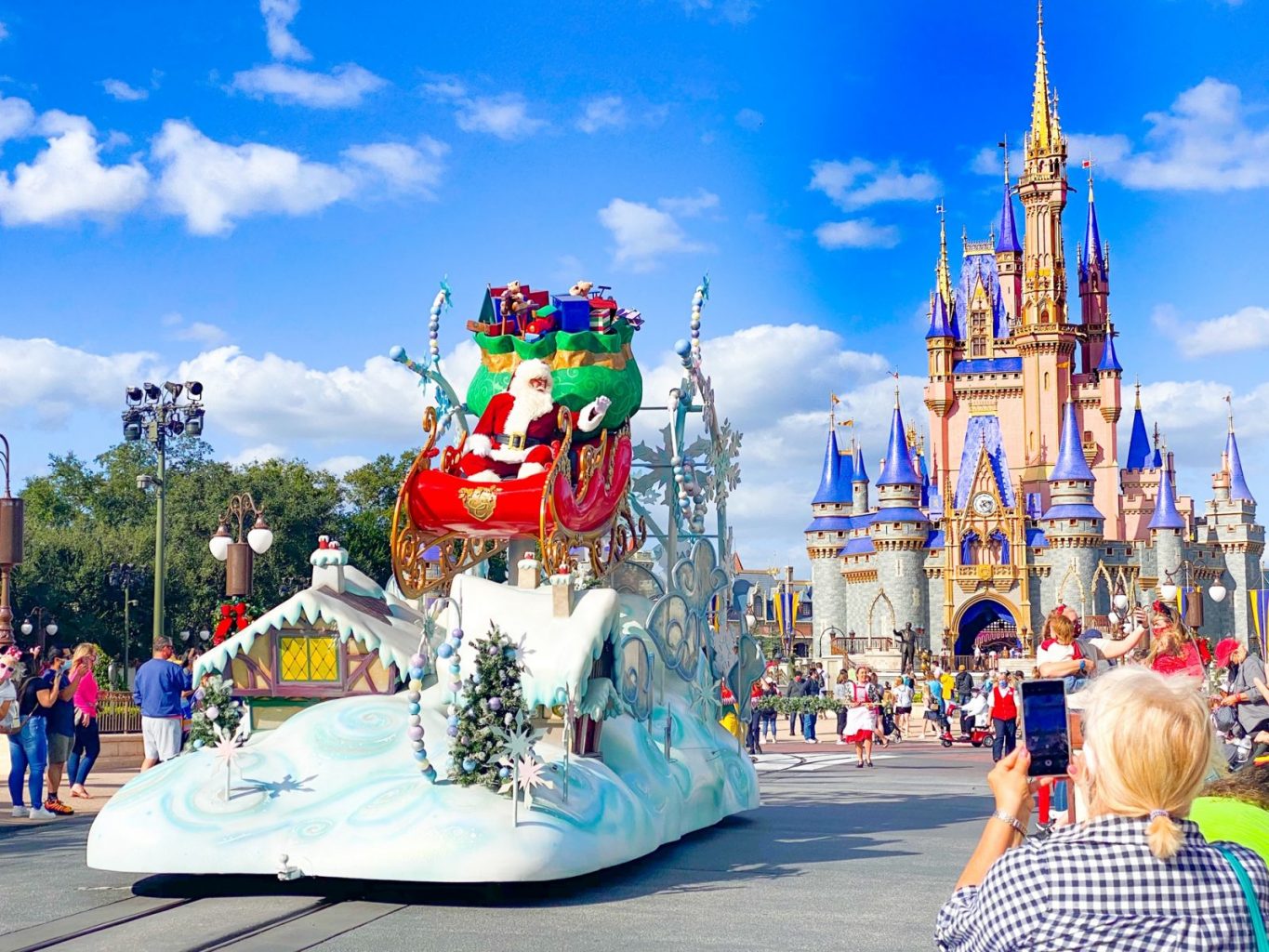 Santa and his sleigh in front of Cinderella's Castle at Disney Christmas 2020