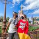 couple in font of cinderella castle
