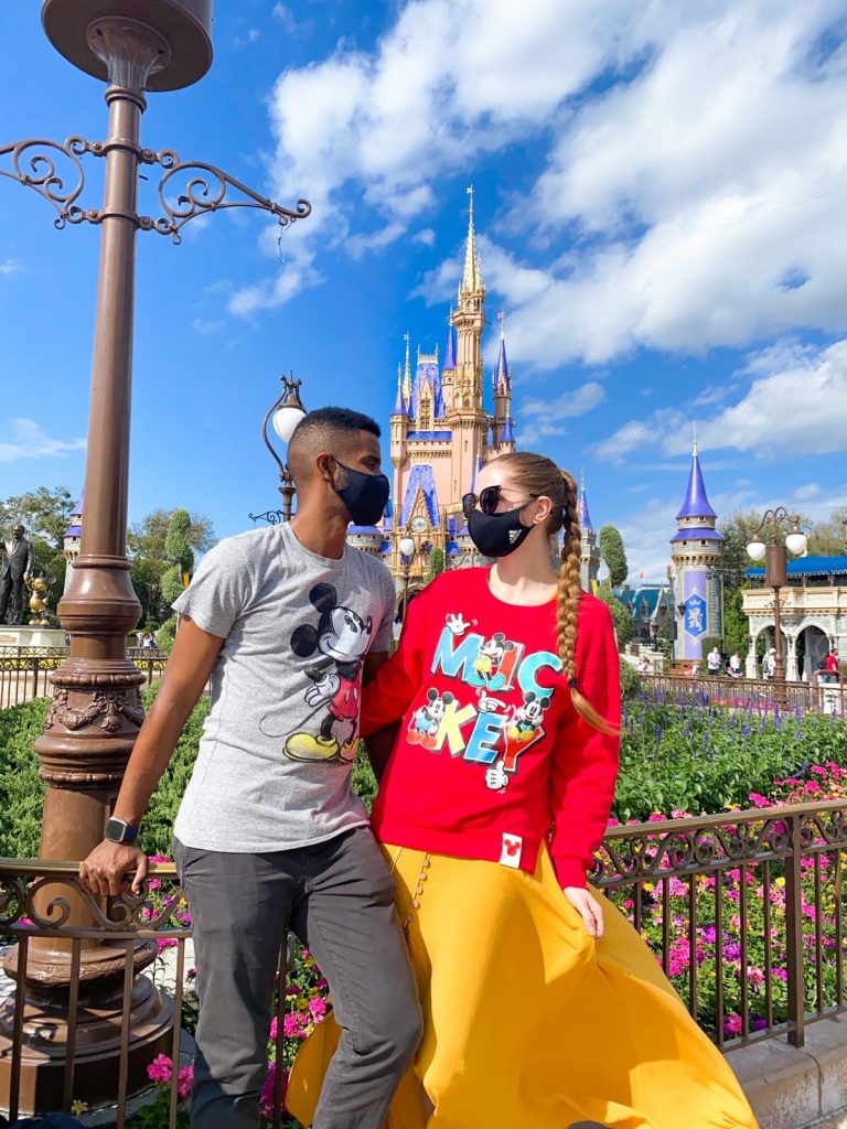 couple in font of cinderella castle 