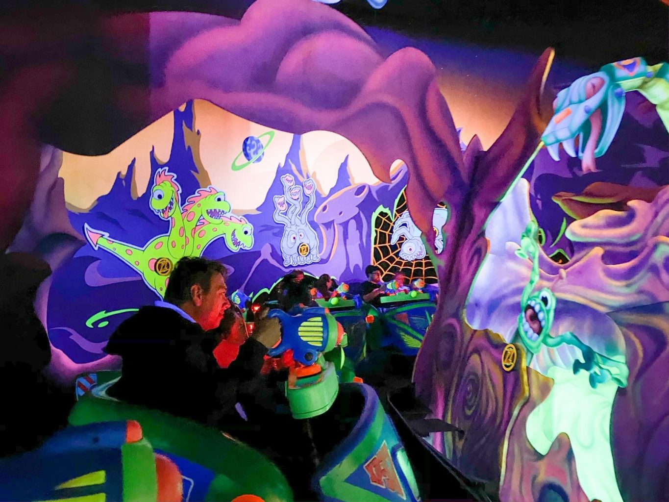 people riding the Buzz Lightyear ride