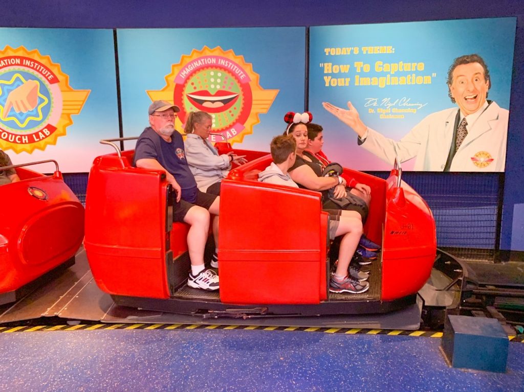 people getting on the Journey Into Imagination with Figment ride