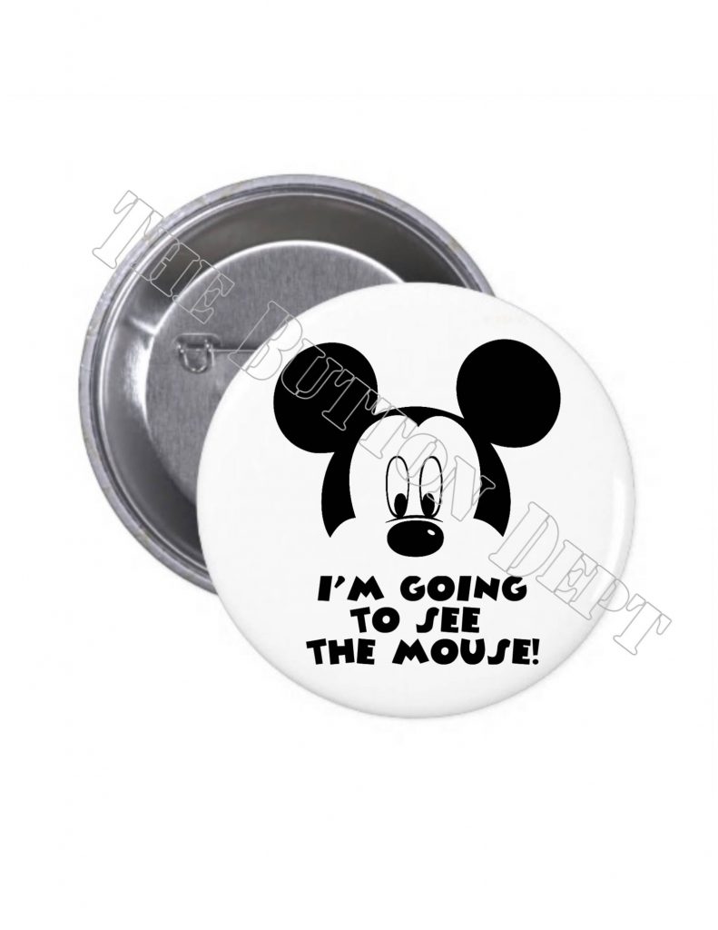 disney surprise trip button white background and black text with Mickey on it