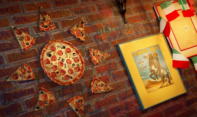 Pizza on the wall of Mama Melrose's