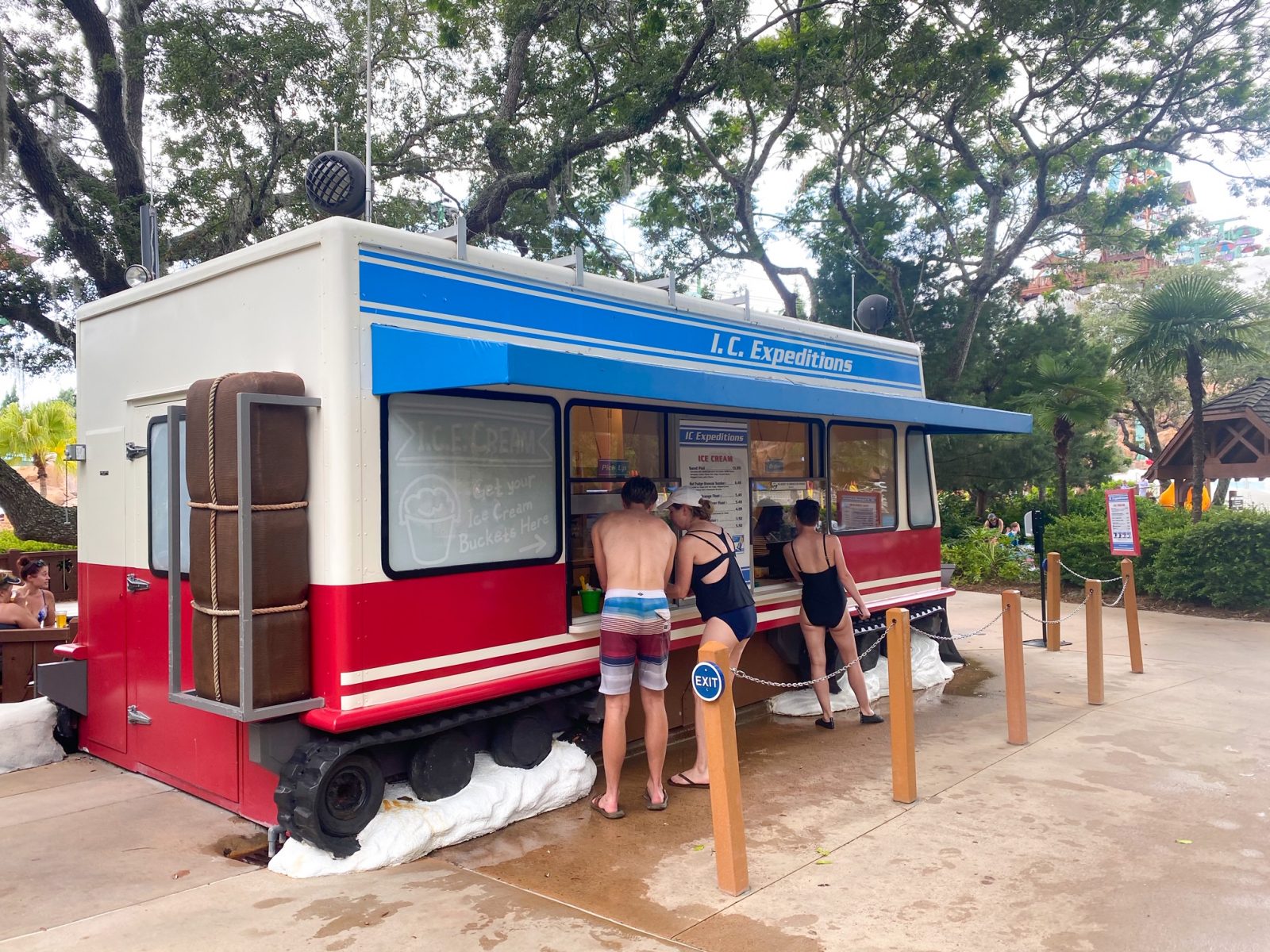 people being served at a snowmobile shaped bar