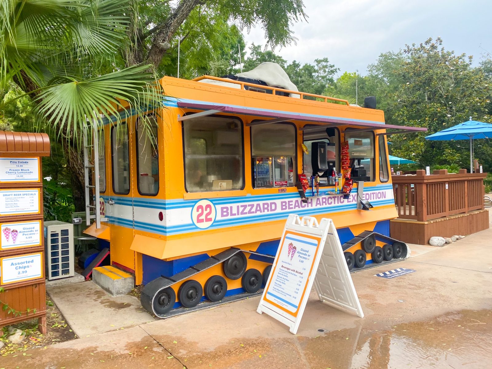 orange food kiosk that looks like a snowmobile