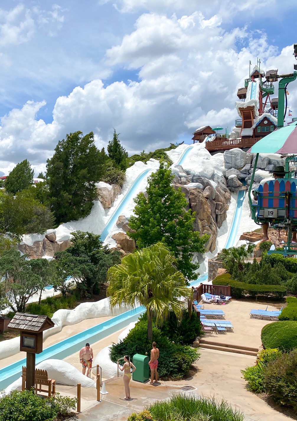 water park mountain, water slides and clouds