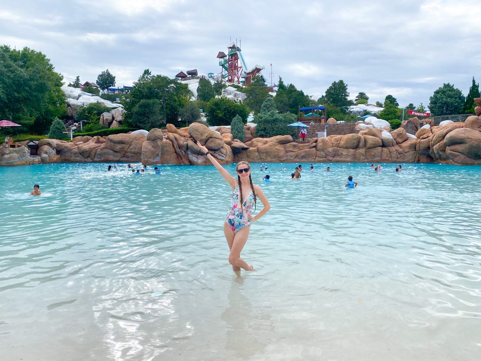 woman standing in wave pool at blizzard beach and clouds