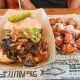 loaded bbq sandwich and tater tots at polite pig