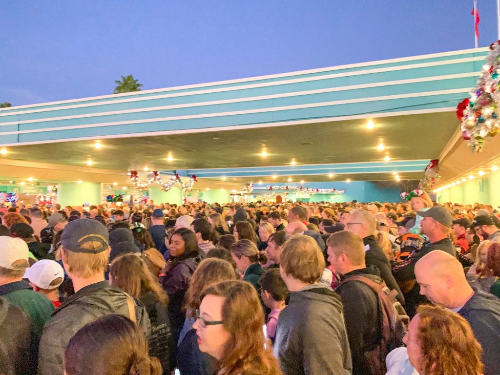 crowds standing at the entrance of disney showing a way to ruin a disney vacation