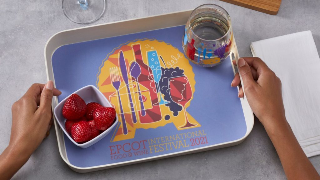 epcot food and wine festival tray with strawberries and glass of water showing off 2021 logo