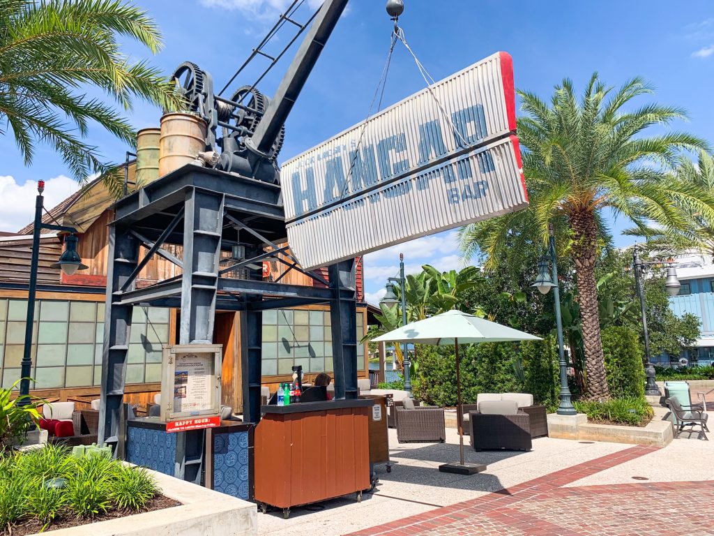 sign at hangar bar with trees and restaurant