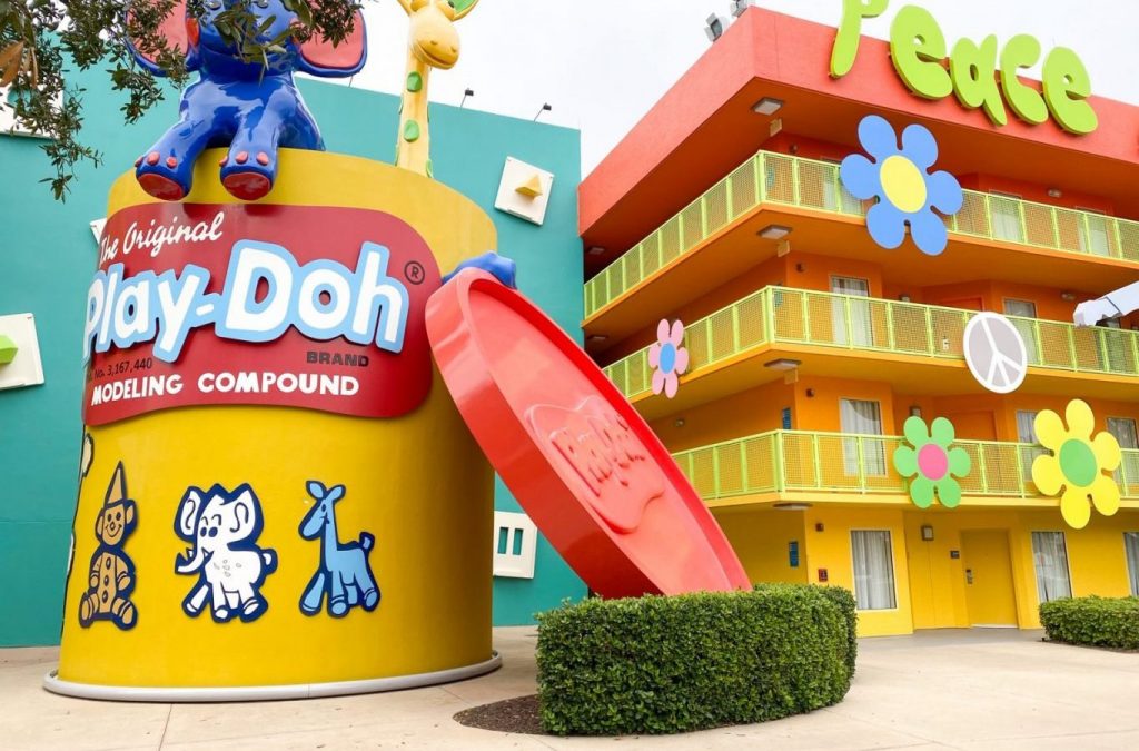 giant play-doh container and flowers on hotel building at Pop Century, one of the best Disney Value Resorts