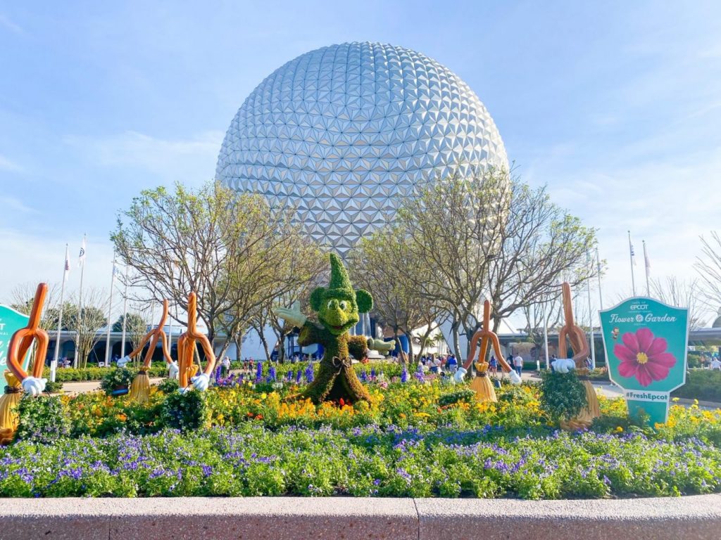 During the Flower and Garden Festival, tress and flowers are cut and morphed into iconic Disney characters: this picture has Mickey in front of Spaceship Earth: you don't need Epcot Genie+ for these festivals. 