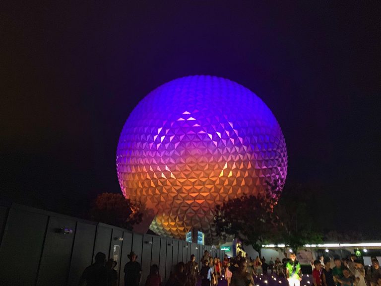The Epcot ball at night shines in different colors: this is a ride, so use Epcot Genie+ for it! 