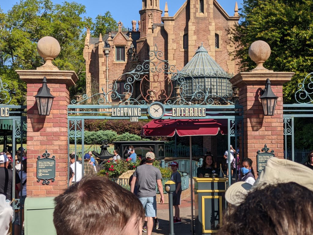 People entering the Lightning Lane entrance to Haunted Mansion after reserving their time using our Disney Genie tips. 