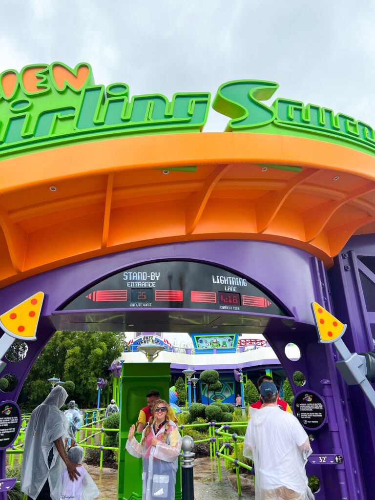Guests entering the lines for Alien Swirling Saucers, one of the rides available using our Disney Genie hacks. 