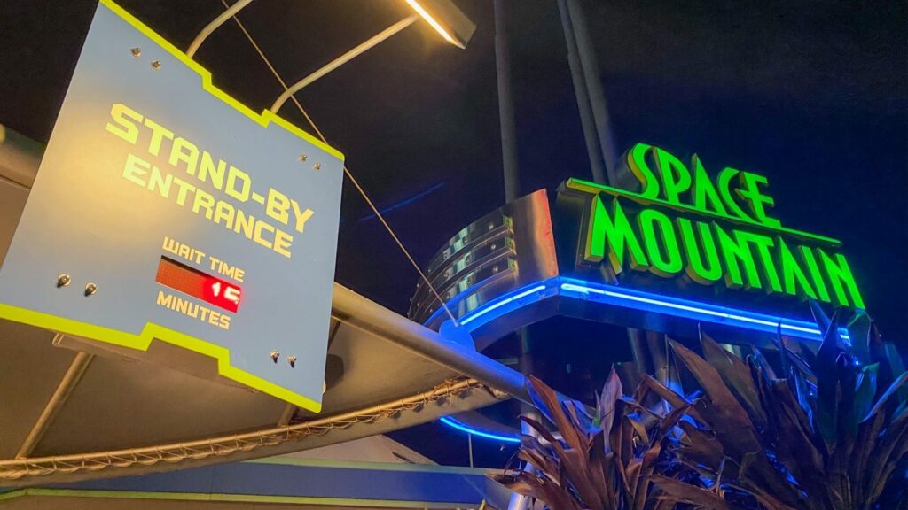 Stand-by entrance to Space Mountain in Magic Kingdom at night, one of the rides worth using our Disney Genie hacks for. 