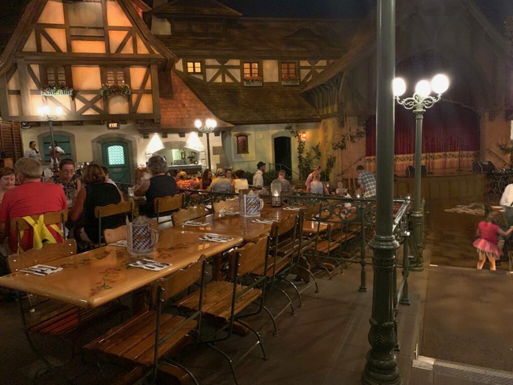guests eating at Biergarten, one of the best places to eat gluten-free at Disney. 