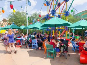 Families enjoying some of the best food  at Hollywood Studios at the ever popular outdoor restaurant, Woody's Lunch Box. 