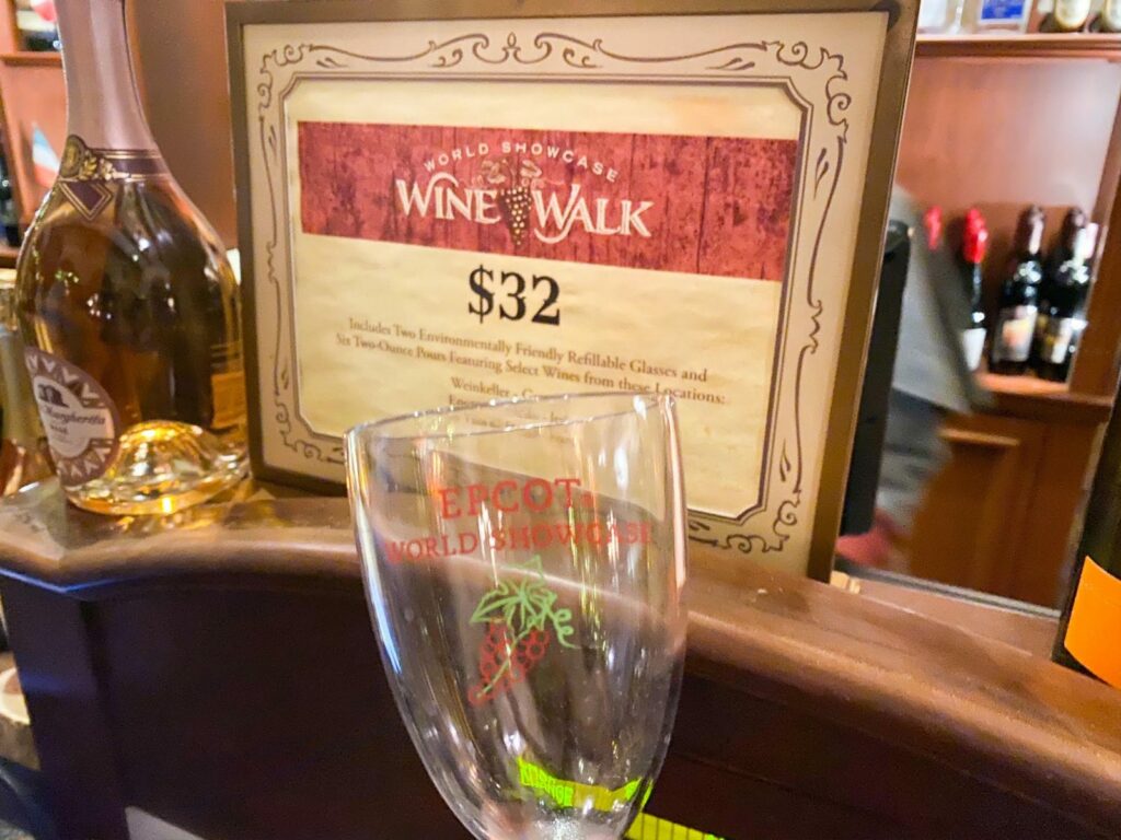 Wine and Walk sign; a great way to drink more and save money, which makes this ideal when it comes to Disney for adults