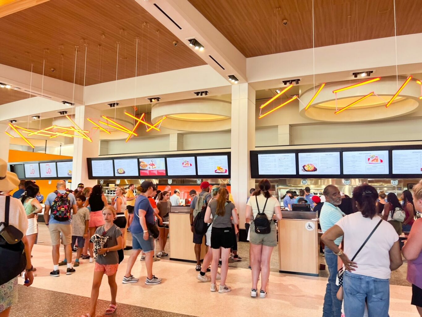 people waiting to order food in connections epcot quick service