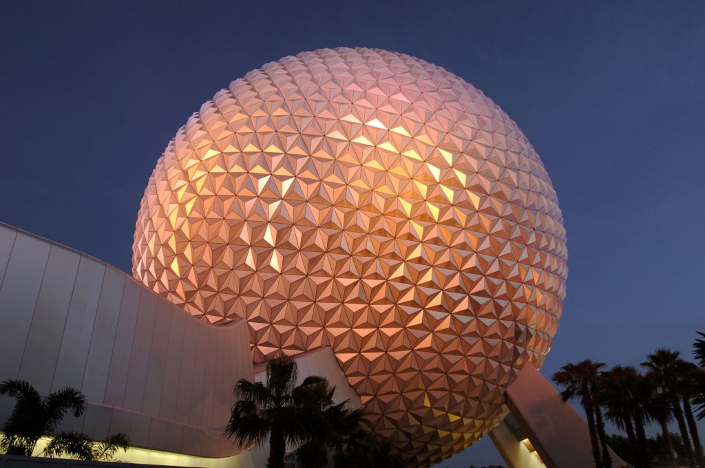 The Epcot ball close up at night in an article about the best time to visit Disney